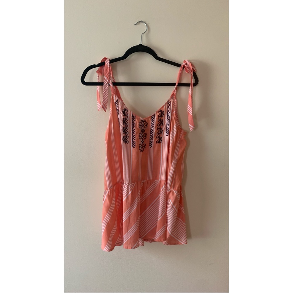 Charlie O. Orange and navy embroidered blouse.